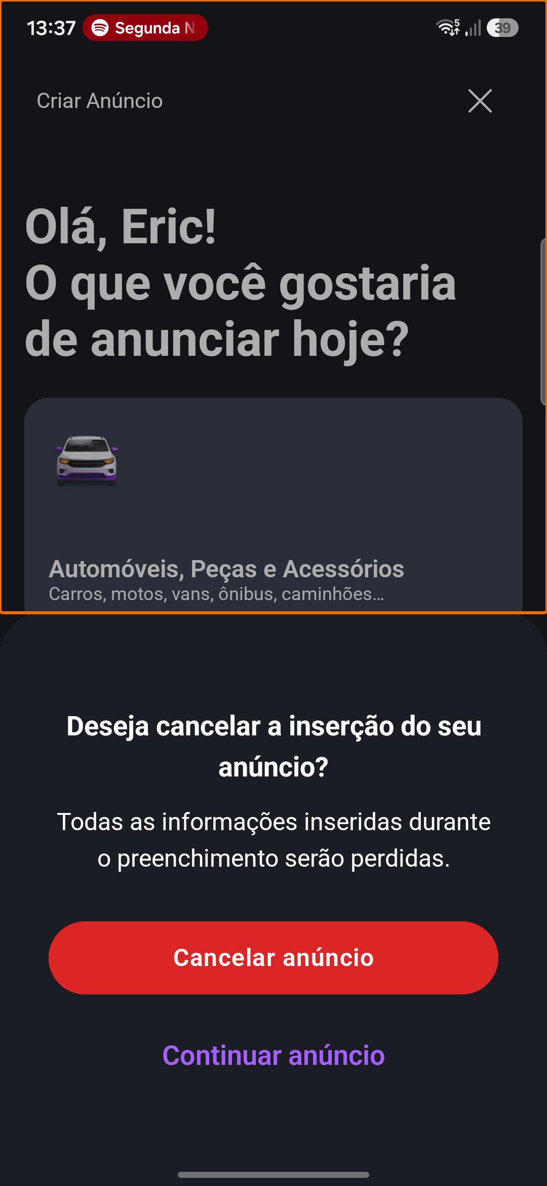 Modal de cancelamento de anúncio da OLX destacado sobre a tela de criação.